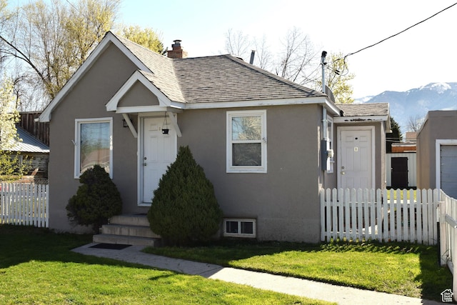 540 S 200 W, Logan, UT 84321 - bungalow-style house with roof with shingles, stucco siding, a chimney, and a mountain view