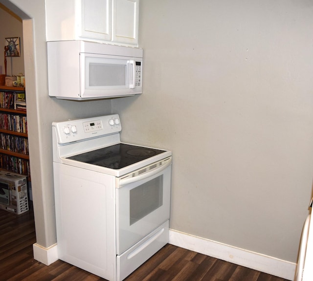 540 S 200 W, Logan, UT 84321 - kitchen featuring white appliances, baseboards, dark wood-type flooring, and white cabinetry