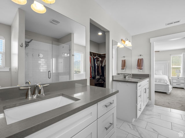 1353 Sageberry Dr, Santaquin, UT 84655 - full bath with vanity, a stall shower, marble look tiles, connected bathroom, and a spacious closet