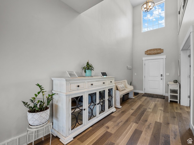 1353 Sageberry Dr, Santaquin, UT 84655 - foyer with a high ceiling, dark wood-style flooring, and a chandelier
