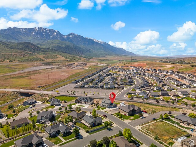 1353 Sageberry Dr, Santaquin, UT 84655 - aerial view of property's location featuring nearby suburban area and a mountain backdrop