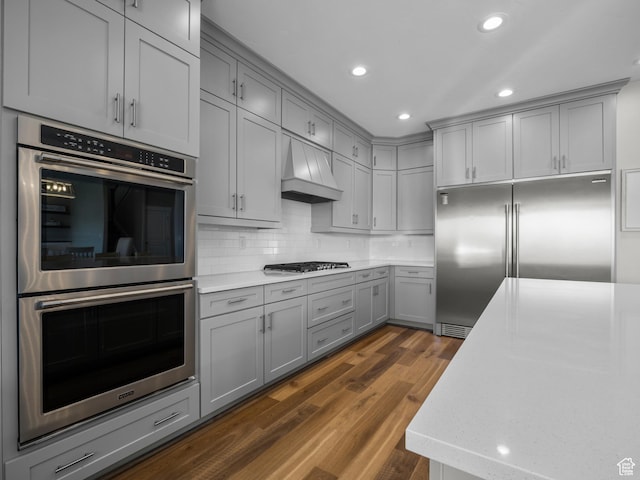 1353 Sageberry Dr, Santaquin, UT 84655 - kitchen featuring gray cabinetry, appliances with stainless steel finishes, custom exhaust hood, dark wood finished floors, and recessed lighting