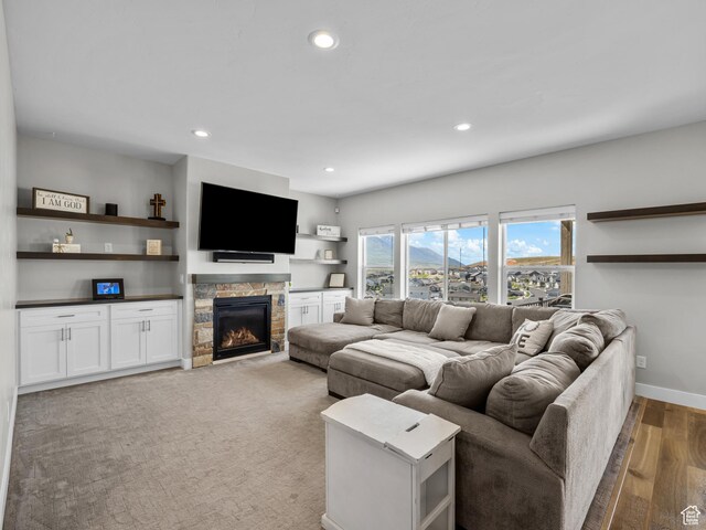 1353 Sageberry Dr, Santaquin, UT 84655 - living room with recessed lighting, a stone fireplace, and light wood-style floors