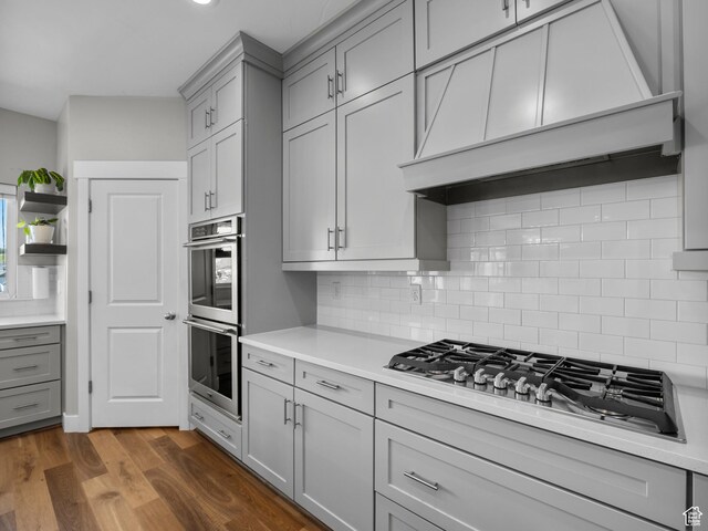 1353 Sageberry Dr, Santaquin, UT 84655 - kitchen with gray cabinets, stainless steel appliances, light countertops, and decorative backsplash