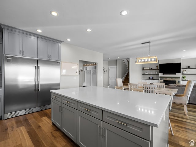 1353 Sageberry Dr, Santaquin, UT 84655 - kitchen featuring built in fridge, gray cabinets, light countertops, a kitchen island, and open floor plan