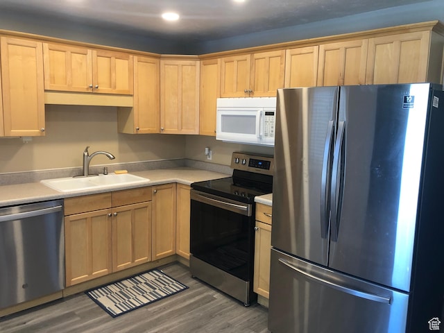399 E 400 N Unit 2A, Bountiful, UT 84010 - kitchen featuring stainless steel appliances, a sink, wood finished floors, light countertops, and light brown cabinets