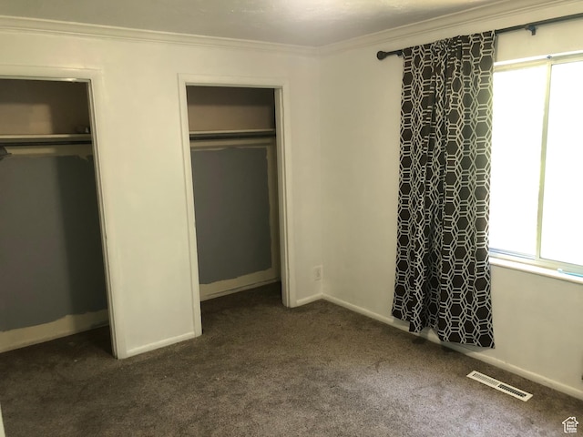 399 E 400 N Unit 2A, Bountiful, UT 84010 - unfurnished bedroom with dark colored carpet, crown molding, multiple closets, and baseboards