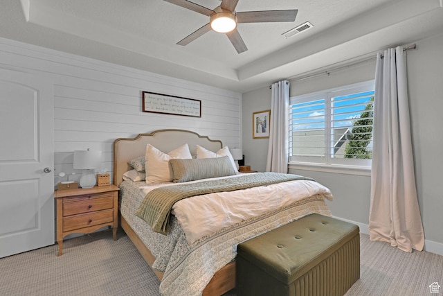 12473 S Desert Mesa Dr, Herriman, UT 84096 - bedroom with light carpet, a raised ceiling, ceiling fan, wood walls, and baseboards