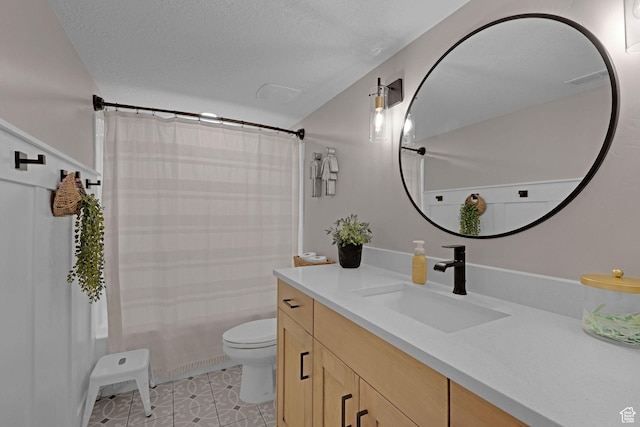 12473 S Desert Mesa Dr, Herriman, UT 84096 - full bath with toilet, vanity, a textured ceiling, tile patterned floors, and shower / bath combo with shower curtain