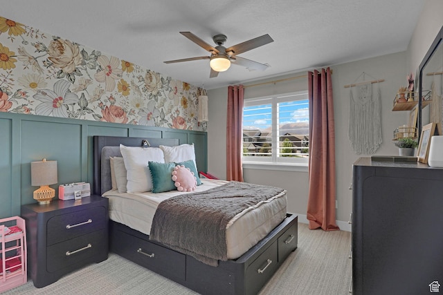 12473 S Desert Mesa Dr, Herriman, UT 84096 - bedroom with wallpapered walls, ceiling fan, and light carpet