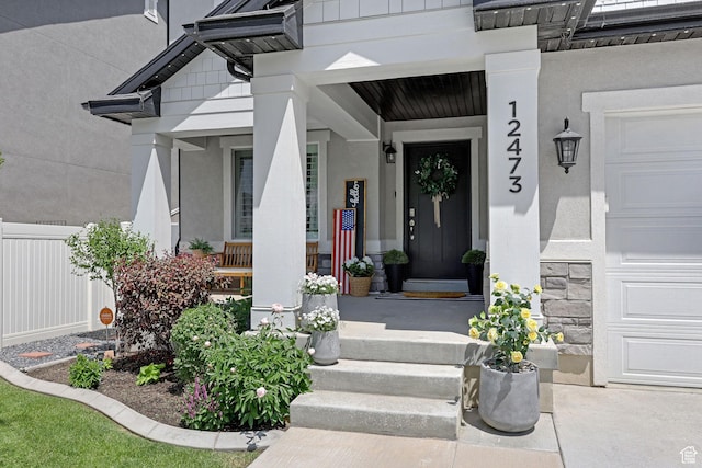 12473 S Desert Mesa Dr, Herriman, UT 84096 - entrance to property with a porch, stucco siding, and a garage