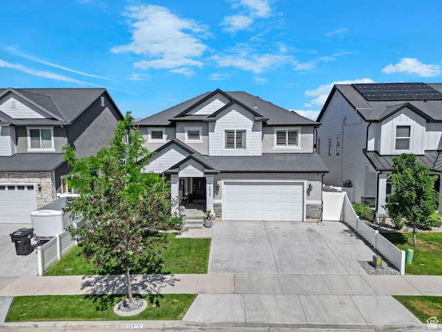 12473 S Desert Mesa Dr, Herriman, UT 84096 - view of front of home with a garage, concrete driveway, and stone siding