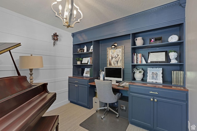 12473 S Desert Mesa Dr, Herriman, UT 84096 - office space featuring a chandelier, light colored carpet, built in shelves, crown molding, and a textured ceiling
