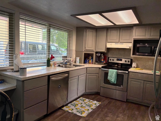6072 S 2550 W, Roy, UT 84067 - kitchen with stainless steel appliances, under cabinet range hood, a sink, and plenty of natural light