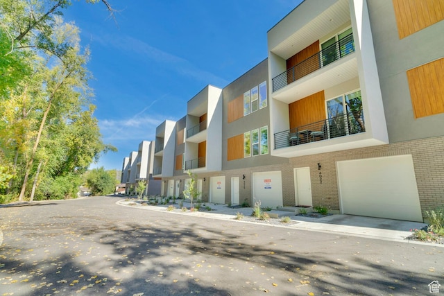 4022 S Burch Creek Way S, Ogden, UT 84405 - view of building exterior with an attached garage