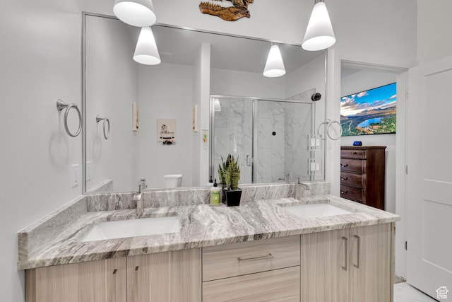 4022 S Burch Creek Way S, Ogden, UT 84405 - bathroom featuring double vanity, a marble finish shower, and toilet