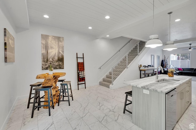 4022 S Burch Creek Way S, Ogden, UT 84405 - kitchen with stainless steel dishwasher, a sink, light marble finish floors, open floor plan, and recessed lighting