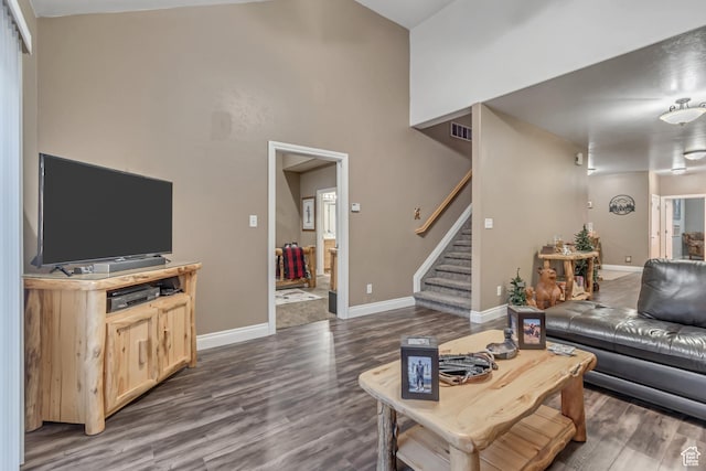 3094 E Somerset Dr, Spanish Fork, UT 84660 - living area with stairway, wood finished floors, baseboards, and high vaulted ceiling