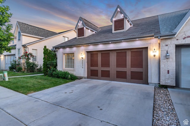 3094 E Somerset Dr, Spanish Fork, UT 84660 - view of front facade with driveway, a front lawn, an attached garage, stucco siding, and roof with shingles