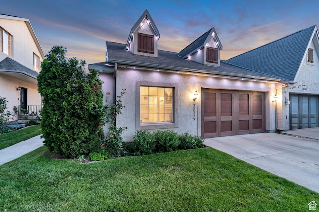 3094 E Somerset Dr, Spanish Fork, UT 84660 - view of front of home featuring concrete driveway, a garage, a lawn, and stucco siding