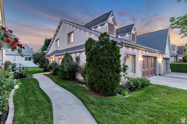 3094 E Somerset Dr, Spanish Fork, UT 84660 - view of side of home with driveway, stucco siding, a yard, and roof with shingles