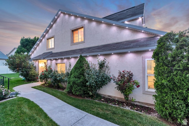 3094 E Somerset Dr, Spanish Fork, UT 84660 - property exterior at dusk featuring stucco siding and a yard