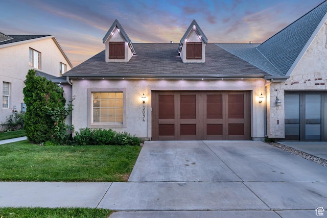 3094 E Somerset Dr, Spanish Fork, UT 84660 - view of front of home with concrete driveway, an attached garage, a yard, and stucco siding
