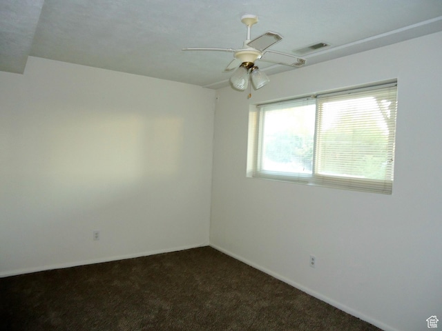 783 N Highland Blvd, Brigham City, UT 84302 - unfurnished room featuring dark colored carpet, a ceiling fan, and baseboards