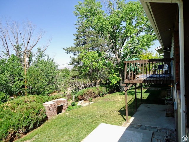 783 N Highland Blvd, Brigham City, UT 84302 - view of green lawn with a patio area and a wooden deck