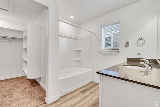 3800 W 560 N Unit 509, Lehi, UT 84043 - full bath featuring bathing tub / shower combination, vanity, baseboards, and wood finished floors