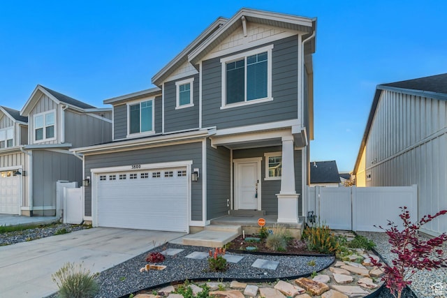 3800 W 560 N Unit 509, Lehi, UT 84043 - view of front of house with a garage, driveway, and board and batten siding