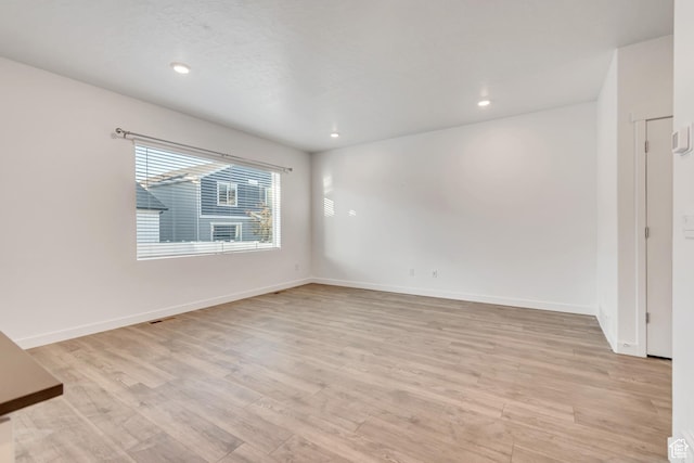 3800 W 560 N Unit 509, Lehi, UT 84043 - empty room with light wood-style floors, baseboards, and recessed lighting