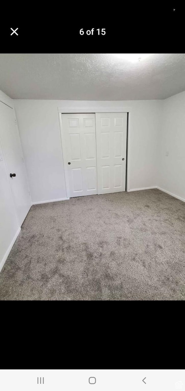 4781 S 3040 W, Taylorsville, UT 84129 - unfurnished bedroom with carpet, a closet, and baseboards