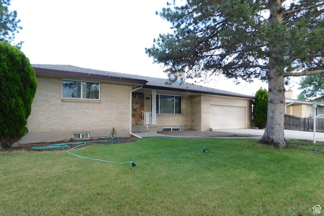 4781 S 3040 W, Taylorsville, UT 84129 - single story home with brick siding, an attached garage, concrete driveway, and a front lawn