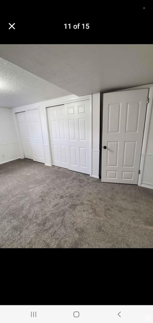 4781 S 3040 W, Taylorsville, UT 84129 - unfurnished bedroom featuring carpet and a textured ceiling