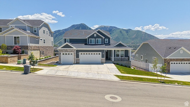 833 N Union Bench Dr W Unit 62, Mapleton, UT 84664 - craftsman-style house featuring concrete driveway, a mountain view, a garage, and stone siding
