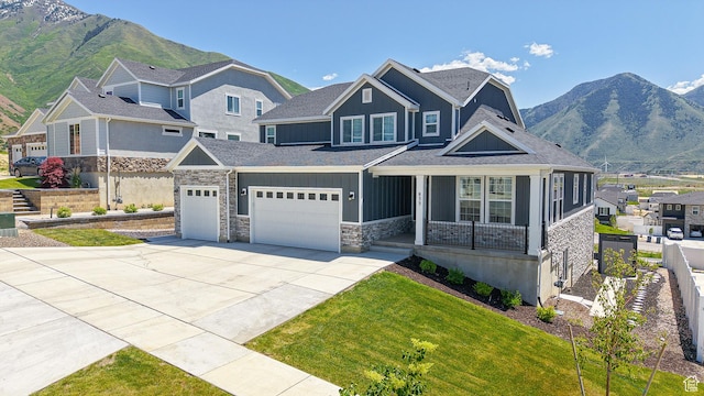 833 N Union Bench Dr W Unit 62, Mapleton, UT 84664 - craftsman house with a porch, board and batten siding, concrete driveway, and a mountain view