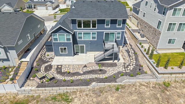 833 N Union Bench Dr W Unit 62, Mapleton, UT 84664 - rear view of house with stucco siding, a residential view, roof with shingles, stairway, and a fenced backyard