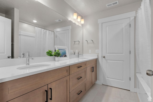 833 N Union Bench Dr W Unit 62, Mapleton, UT 84664 - full bath featuring double vanity, tile patterned flooring, recessed lighting, and baseboards