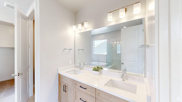 833 N Union Bench Dr W Unit 62, Mapleton, UT 84664 - full bath featuring a stall shower, double vanity, a bath, a walk in closet, and baseboards