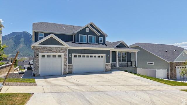 833 N Union Bench Dr W Unit 62, Mapleton, UT 84664 - craftsman-style home with stone siding, board and batten siding, driveway, a garage, and a shingled roof