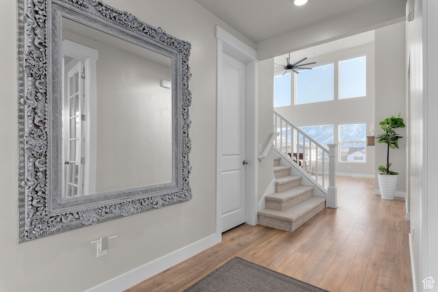 833 N Union Bench Dr W Unit 62, Mapleton, UT 84664 - hall with baseboards, wood finished floors, stairs, and recessed lighting