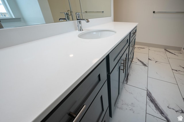 622 S 85 E Unit 4, Smithfield, UT 84335 - bathroom featuring marble finish flooring, vanity, and baseboards