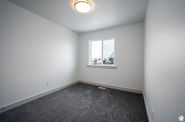 622 S 85 E Unit 4, Smithfield, UT 84335 - unfurnished room with dark colored carpet and baseboards