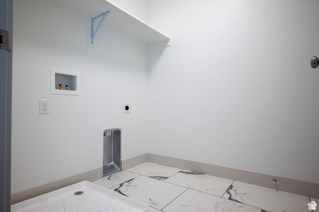 622 S 85 E Unit 4, Smithfield, UT 84335 - laundry area with washer hookup, marble look tile flooring, and baseboards