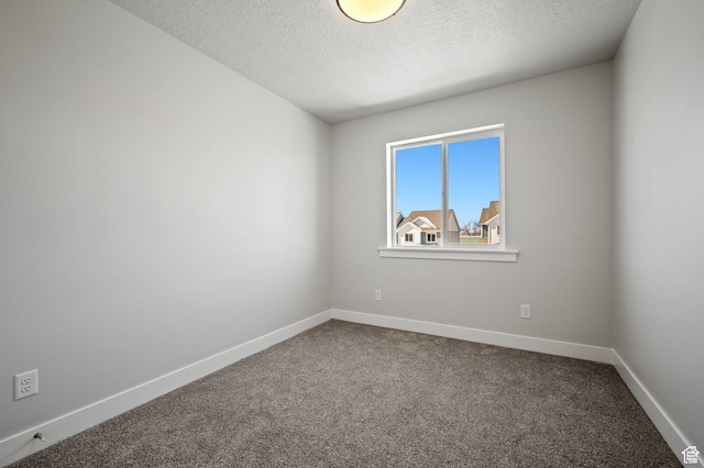 636 S 85 E Unit 6, Smithfield, UT 84335 - unfurnished room featuring dark carpet, baseboards, and a textured ceiling