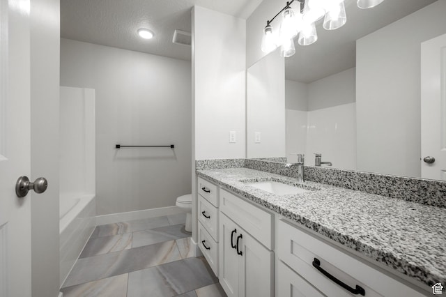 636 S 85 E Unit 6, Smithfield, UT 84335 - bathroom with vanity, toilet, marble look tile flooring, and baseboards