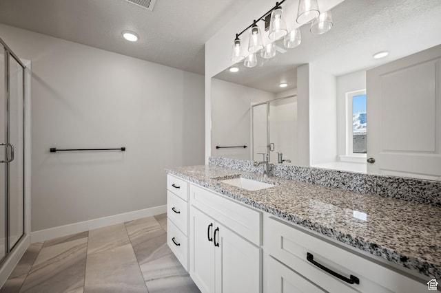 636 S 85 E Unit 6, Smithfield, UT 84335 - bathroom featuring vanity, baseboards, a stall shower, a textured ceiling, and recessed lighting