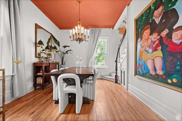 237 E 4th Ave N, Salt Lake City, UT 84103 - dining space with ornamental molding, a chandelier, light wood finished floors, and baseboards