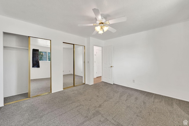 2652 W 6050 S, Roy, UT 84067 - unfurnished bedroom featuring two closets, carpet, ceiling fan, and baseboards